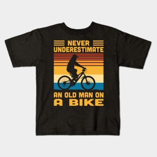 Never Underestimate An Old Man On A Bike Kids T-Shirt